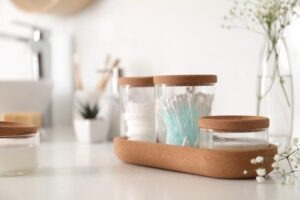 glass-jars-cotton-pads-buds-countertop-bathroom-space-text-209087687
