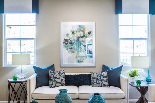 Keep Your House Cooler This Summer With These Helpful Tips couch near painting